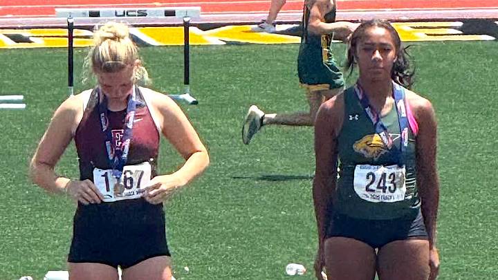 Paige Newland of Emporia (left) and Kimberlee Scott of Basehor-Linwood standing on the podium at the 2026 Kansas High School State Track and Field Championships. May 29, 2026. Scott earned the triple jump and long jump title. Paige Newland of Emporia (left) and Kimberlee Scott of Basehor-Linwood standing on the podium at the 2026 Kansas High School State Track and Field Championships. May 29, 2026. Scott earned the triple jump and long jump title.