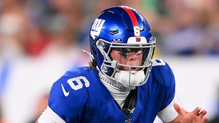 Aug 16, 2025; East Rutherford, New Jersey, USA; New York Giants quarterback Jaxson Dart (6) runs against the New York Jets during the second half at MetLife Stadium.  