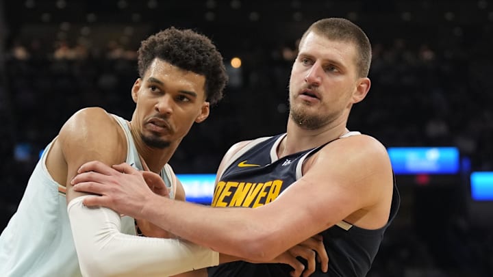 Jan 4, 2025; San Antonio, Texas, USA; San Antonio Spurs center Victor Wembanyama (1) and Denver Nuggets center Nikola Jokic (15) battle for position during an inbound pass in the second half at Frost Bank Center. Mandatory Credit: Scott Wachter-Imagn Images