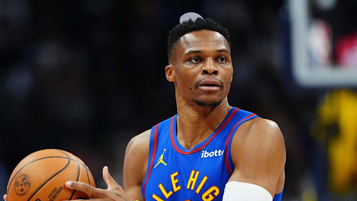 Nov 8, 2024; Denver, Colorado, USA; Denver Nuggets guard Russell Westbrook (4) during the first quarter against the Miami Heat at Ball Arena. Mandatory Credit: Ron Chenoy-Imagn Images
