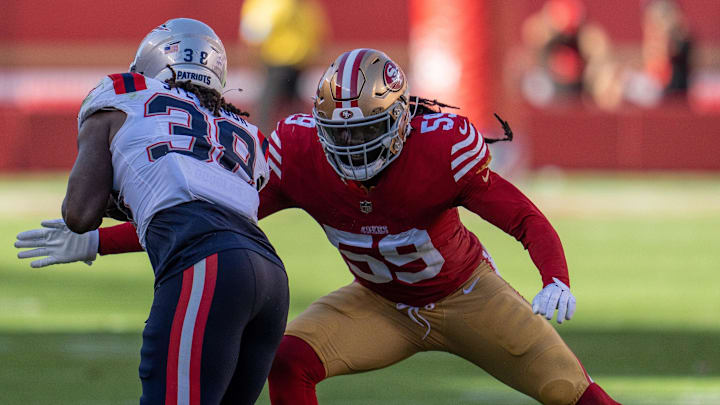 Sep 29, 2024; Santa Clara, California, USA; San Francisco 49ers linebacker De'Vondre Campbell (59) tackles New England Patriots running back Rhamondre Stevenson (38) during the fourth quarter at Levi's Stadium. Mandatory Credit: Neville E. Guard-Imagn Images