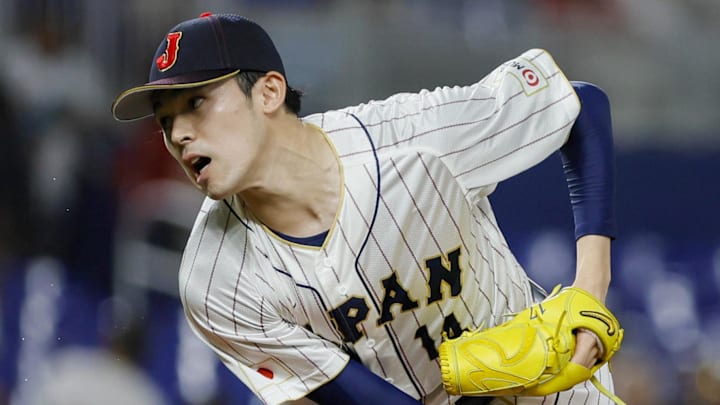 Mar 20, 2023; Miami, Florida, USA; Japan starting pitcher Roki Sasaki (14) delivers a pitch during the first inning against Mexico at LoanDepot Park