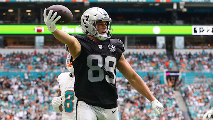 Nov 17, 2024; Miami Gardens, Florida, USA; Las Vegas Raiders tight end Brock Bowers (89) runs with the football for a touchdown against the Miami Dolphins during the third quarter at Hard Rock Stadium. Mandatory Credit: Sam Navarro-Imagn Images