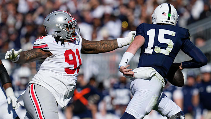 Ohio State Buckeyes defensive tackle Tyleik Williams (91) pursues Penn State Nittany Lions quarterback Drew Allar (15) Ohio State Buckeyes defensive tackle Tyleik Williams (91) pursues Penn State Nittany Lions quarterback Drew Allar (15)