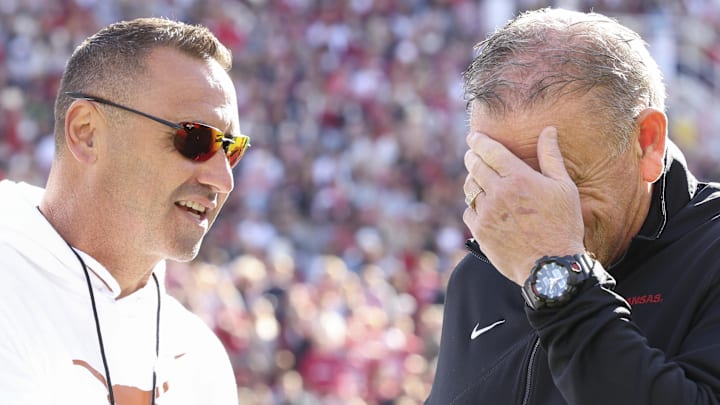 Texas Longhorns head coach Steve Sarkisian and Arkansas Razorbacks head coach Sam Pittman interact prior to the game at Donald W. Reynolds Razorback Stadium. 