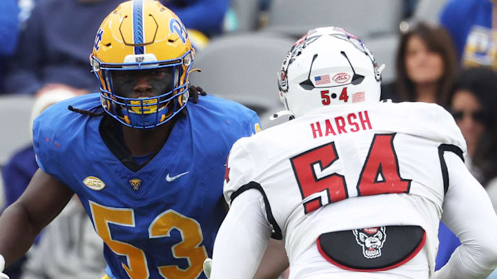 Oct 25, 2025; Pittsburgh, Pennsylvania, USA;  Pittsburgh Panthers offensive lineman Kendall Stanley (53) blocks at the line of scrimmage against North Carolina State Wolfpack defensive end Sabastian Harsh (54) during the second quarter at Acrisure Stadium. Mandatory Credit: Charles LeClaire-Imagn Images
