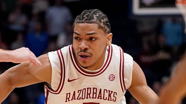 Arkansas guard Darius Acuff Jr. (5) pushes past Mississippi guard Travis Perry (11) during overtime in a SEC tournament semifinal game at Bridgestone Arena in Nashville, Tenn., Saturday, March 14, 2026.