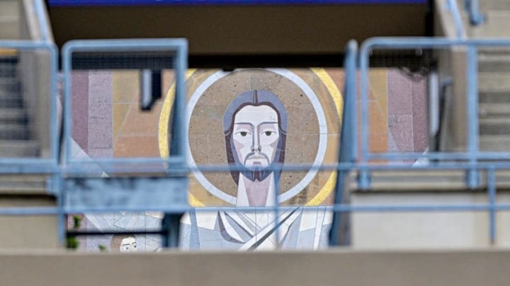 Apr 20, 2024; Notre Dame, IN, USA; A detail of the Word of Life Mural, commonly known as Touchdown Jesus, seen through a stadium entrance during the Blue-Gold game at Notre Dame Stadium. Apr 20, 2024; Notre Dame, IN, USA; A detail of the Word of Life Mural, commonly known as Touchdown Jesus, seen through a stadium entrance during the Blue-Gold game at Notre Dame Stadium.