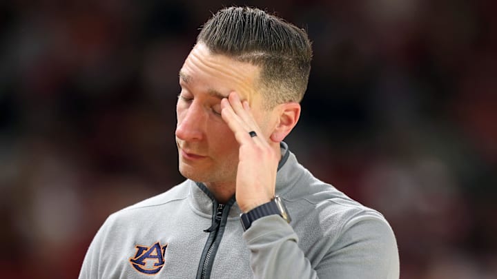 Feb 14, 2026; Fayetteville, Arkansas, USA; Auburn Tigers head coach Steven Pearl reacts to a play during the second half against the Arkansas Razorbacks at Bud Walton Arena. Mandatory Credit: Nelson Chenault-Imagn Images