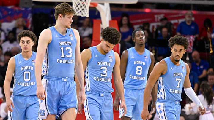 Jan 3, 2026; Dallas, Texas, USA; North Carolina Tar Heels guard Kyan Evans (0) and center Henri Veesaar (13) and guard Derek Dixon (3) and forward Caleb Wilson (8) and guard Seth Trimble (7) come back on the court during the second half against the SMU Mustangs at Moody Coliseum. Mandatory Credit: Jerome Miron-Imagn Images Jan 3, 2026; Dallas, Texas, USA; North Carolina Tar Heels guard Kyan Evans (0) and center Henri Veesaar (13) and guard Derek Dixon (3) and forward Caleb Wilson (8) and guard Seth Trimble (7) come back on the court during the second half against the SMU Mustangs at Moody Coliseum. Mandatory Credit: Jerome Miron-Imagn Images