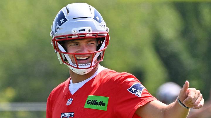 Jul 25, 2026; Foxborough, MA, USA; New England Patriots quarterback Drake Maye (10) reacts to a teammate at training camp at Gillette Stadium. Mandatory Credit: Eric Canha-Imagn Images