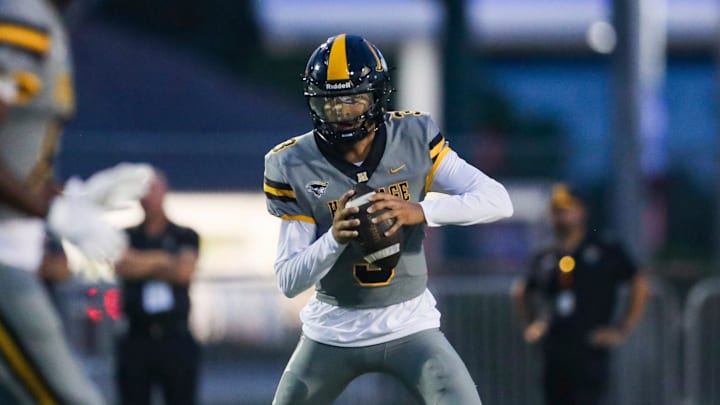 American Heritage Patriots quarterback Dia Bell (3), a University of Texas 5-star commit, suffered a leg injury in Friday's playoff game against Dillard and was carted off the field.