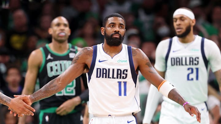 Jun 9, 2024; Boston, Massachusetts, USA; Dallas Mavericks guard Kyrie Irving (11) high fives forward P.J. Washington (25) after a play against the Boston Celtics during the third quarter in game two of the 2024 NBA Finals at TD Garden. Mandatory Credit: Peter Casey-USA TODAY Sports