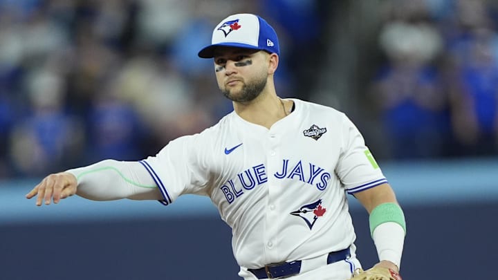 Nov 1, 2025; Toronto, Ontario, CAN; Toronto Blue Jays designated hitter Bo Bichette (11) throws to first for an out against Los Angeles Dodgers second baseman Tommy Edman (25) in the eighth inning during game seven of the 2025 MLB World Series at Rogers Centre. Mandatory Credit: John E. Sokolowski-Imagn Images Nov 1, 2025; Toronto, Ontario, CAN; Toronto Blue Jays designated hitter Bo Bichette (11) throws to first for an out against Los Angeles Dodgers second baseman Tommy Edman (25) in the eighth inning during game seven of the 2025 MLB World Series at Rogers Centre. Mandatory Credit: John E. Sokolowski-Imagn Images