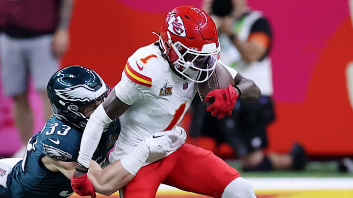 Feb 9, 2025; New Orleans, LA, USA; Kansas City Chiefs wide receiver Xavier Worthy (1) runs with the ball against Philadelphia Eagles cornerback Cooper DeJean (33) during the first half of Super Bowl LIX at Caesars Superdome. Mandatory Credit: Bill Streicher-Imagn Images