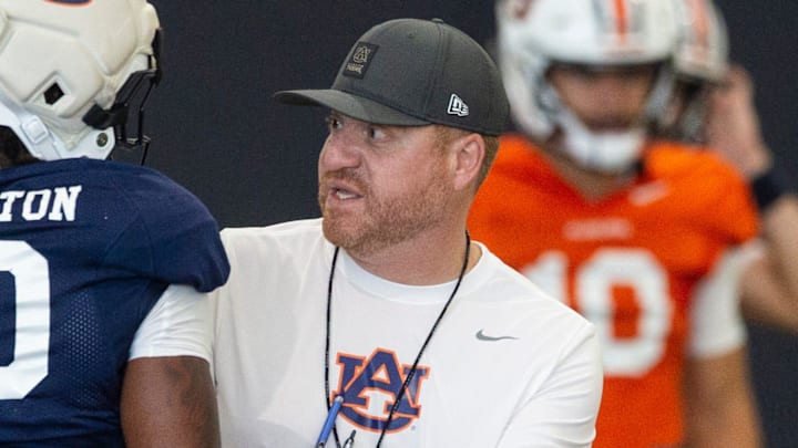 Auburn Tigers head coach Alex Golesh talks with Auburn Tigers running back Bryson Washington (30) during practice at Woltosz Football Performance Center in Auburn, Ala. on Thursday, April 16, 2026.