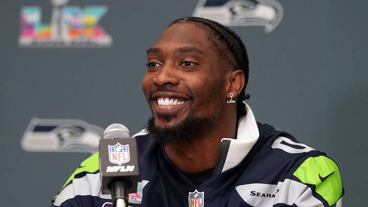 Seattle Seahawks defensive end DeMarcus Lawrence talks to media members before Super Bowl LX 