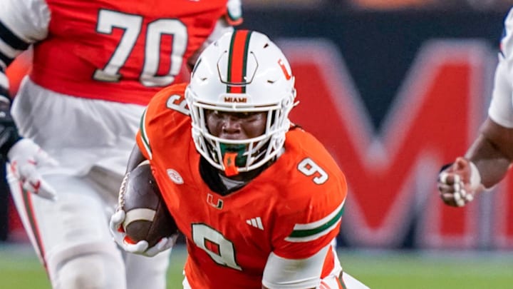Nov 8, 2025; Miami Gardens, Florida, USA; Miami Hurricanes tight end Elija Lofton (9) rushes after catching a pass against the Syracuse Orange during the third quarter at Hard Rock Stadium. Mandatory Credit: Jeff Romance-Imagn Images