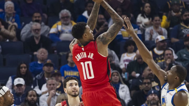 Dec 5, 2024; San Francisco, California, USA;  Houston Rockets forward Jabari Smith Jr. (10) shoots over Golden State Warriors forward Jonathan Kuminga (00) during the first quarter at Chase Center. Mandatory Credit: John Hefti-Imagn Images