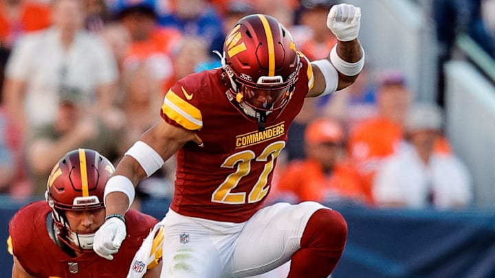 Sep 17, 2023; Denver, Colorado, USA; Denver Broncos quarterback Russell Wilson (3) slides for a first down against Washington Commanders safety Darrick Forrest (22) and linebacker Cody Barton (57) in the fourth quarter at Empower Field at Mile High. Mandatory Credit: Isaiah J. Downing-Imagn Images Sep 17, 2023; Denver, Colorado, USA; Denver Broncos quarterback Russell Wilson (3) slides for a first down against Washington Commanders safety Darrick Forrest (22) and linebacker Cody Barton (57) in the fourth quarter at Empower Field at Mile High. Mandatory Credit: Isaiah J. Downing-Imagn Images