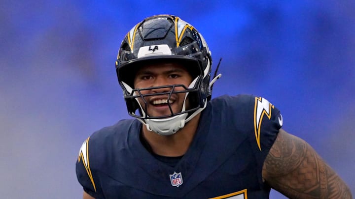 Los Angeles Chargers linebacker Tuli Tuipulotu is introduced for the game against the Minnesota Vikings