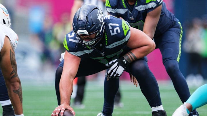 Sep 22, 2024; Seattle, Washington, USA; Seattle Seahawks center Connor Williams (57) prepares to snap the ball during the fourth quarter against the Miami Dolphins at Lumen Field. Mandatory Credit: Kevin Ng-Imagn Images