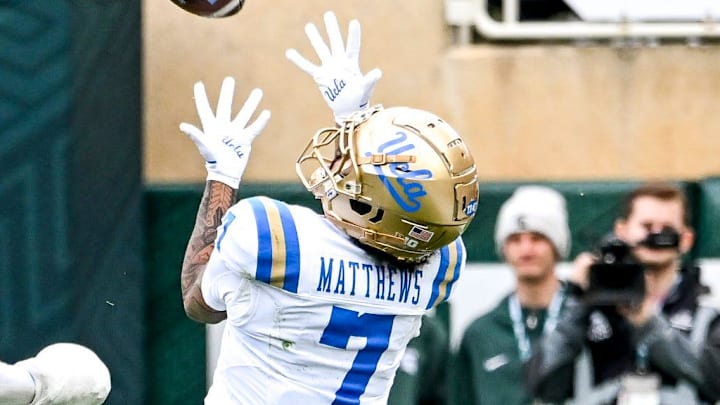 UCLA's Mikey Matthews, right, catches a pass as Michigan State's Dontavius Nash defends during the second quarter on Saturday, Oct. 11, 2025, at Spartan Stadium in East Lansing.
