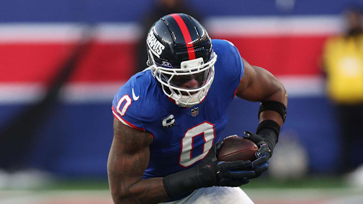 Dec 14, 2025; East Rutherford, New Jersey, USA; New York Giants linebacker Brian Burns (0) runs the ball during the fourth quarter against the Washington Commanders at MetLife Stadium. Dec 14, 2025; East Rutherford, New Jersey, USA; New York Giants linebacker Brian Burns (0) runs the ball during the fourth quarter against the Washington Commanders at MetLife Stadium.