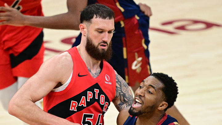 Cleveland Cavaliers guard Donovan Mitchell drives on Toronto Raptors forward Sandro Mamukelashvili.