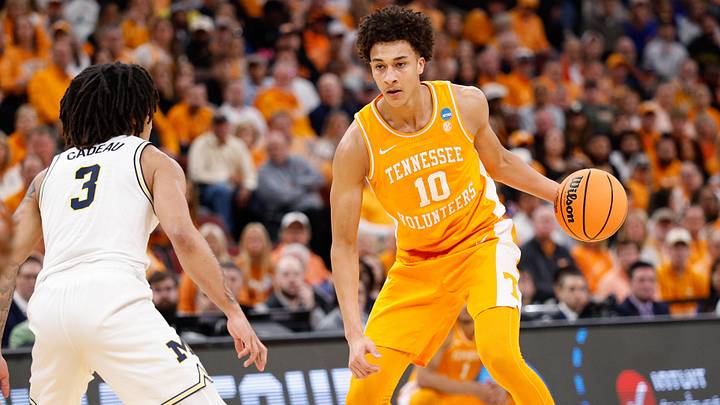 Mar 29, 2026; Chicago, IL, USA; Tennessee Volunteers forward Nate Ament (10) moves the ball while defended by Michigan Wolverines guard Elliot Cadeau (3) in the first half  during an Elite Eight game of the Midwest Regional of the men's 2026 NCAA Tournament at United Center. Mandatory Credit: Kamil Krzaczynski-Imagn Images