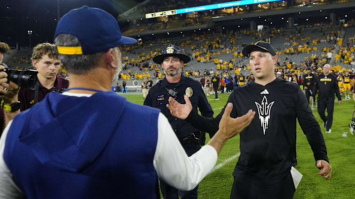 Arizona State head coach Kenny Dillingham shakes hands with NAU head coach Brian Wright (left) after an Arizona State 38-19 win at Mountain America Stadium in Tempe on Aug. 30, 2025.