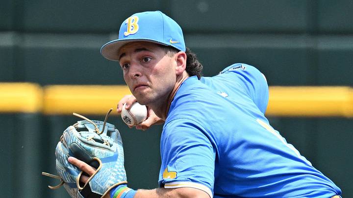 Jun 14, 2025; Omaha, Neb, USA;  UCLA Bruins shortstop Roch Cholowsky (1) completes a double play against the Murray State Racers during the second inning at Charles Schwab Field. Mandatory Credit: Steven Branscombe-Imagn Images