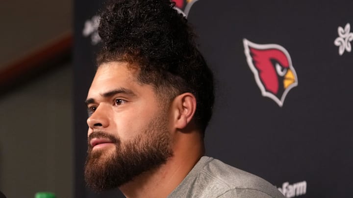 Arizona Cardinals newly signed free agent Isaac Seumalo speaks to the press at the Arizona Cardinals training facility in Tempe, on March 11, 2026.