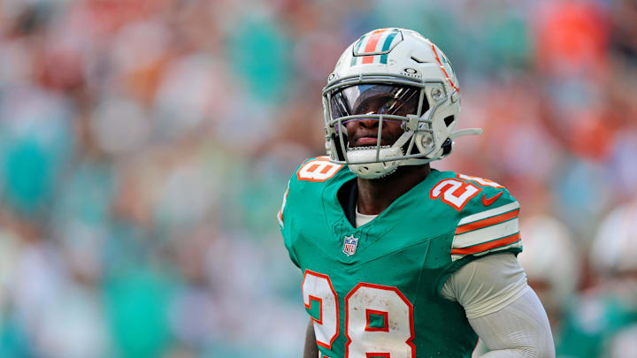 Dec 21, 2025; Miami Gardens, Florida, USA; Miami Dolphins running back De'Von Achane (28) reacts after scoring a touchdown during the first quarter against the Cincinnati Bengals at Hard Rock Stadium. Mandatory Credit: Sam Navarro-Imagn Images