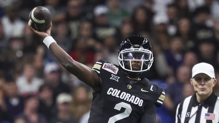 Dec 28, 2024; San Antonio, TX, USA; Colorado Buffaloes quarterback Shedeur Sanders (2) attempts a pass as Brigham Young Cougars defensive end Tyler Batty (92) attempts to make a tackle during the third quarter at Alamodome. Mandatory Credit: Troy Taormina-Imagn Images Dec 28, 2024; San Antonio, TX, USA; Colorado Buffaloes quarterback Shedeur Sanders (2) attempts a pass as Brigham Young Cougars defensive end Tyler Batty (92) attempts to make a tackle during the third quarter at Alamodome. Mandatory Credit: Troy Taormina-Imagn Images