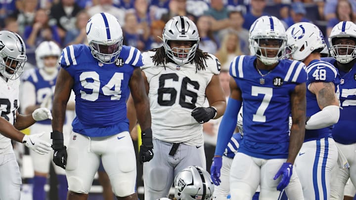 Oct 5, 2025; Indianapolis, Indiana, USA; Indianapolis Colts defensive end Tyquan Lewis (94) looks at Las Vegas Raiders running back Ashton Jeanty (2) after a play during the second quarter at Lucas Oil Stadium. 