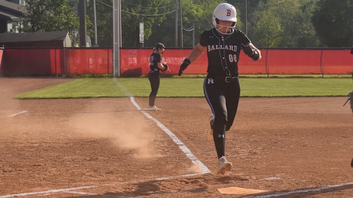 Ballard High School senior Shelby James brings home the Bruins' first run in a 6-0 victory over Mercy Academy Thursday, April 23, 2026.  