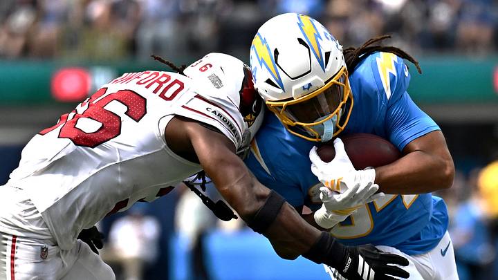 Sep 13, 2026; Inglewood, California, USA; Los Angeles Chargers running back Keaton Mitchell (34) is tackled by Arizona Cardinals safety Kitan Crawford (36) during the first half at SoFi Stadium. Mandatory Credit: William Liang-Imagn Images Sep 13, 2026; Inglewood, California, USA; Los Angeles Chargers running back Keaton Mitchell (34) is tackled by Arizona Cardinals safety Kitan Crawford (36) during the first half at SoFi Stadium. Mandatory Credit: William Liang-Imagn Images