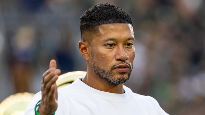 Sep 13, 2025; South Bend, Indiana, USA; Notre Dame Fighting Irish head coach Marcus Freeman greets players before a game against the Texas A&M Aggies at Notre Dame Stadium. 