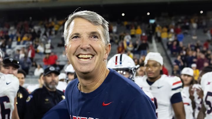 Nov 28, 2025; Tempe, Arizona, USA; Arizona Wildcats head coach Brent Brennan celebrates against the Arizona State Sun Devils during the 99th Territorial Cup at Mountain America Stadium. Mandatory Credit: Mark J. Rebilas-Imagn Images