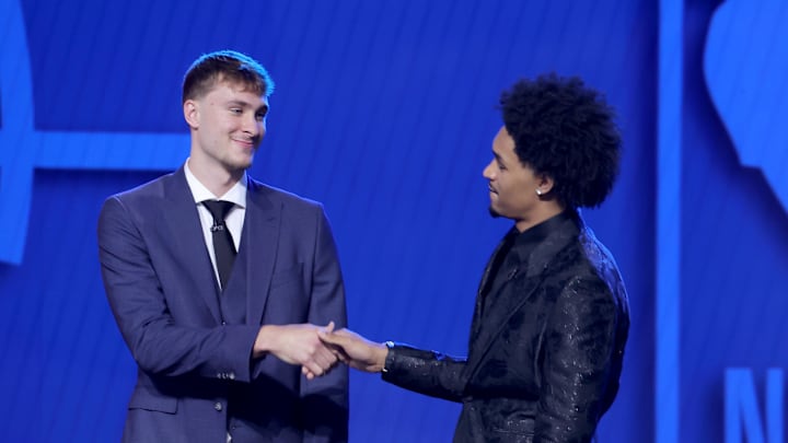 Jun 25, 2025; Brooklyn, NY, USA; Cooper Flagg and Dylan Harper shake hands on stage before the 2025 NBA Draft at Barclays Center. Mandatory Credit: Brad Penner-Imagn Images