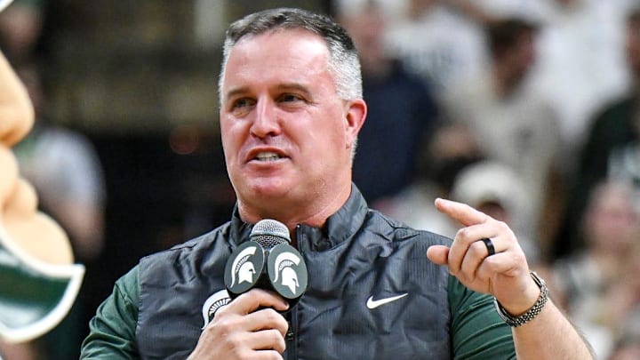 Michigan State's new football coach Pat Fitzgerald addresses the crowd during a timeout in the first half of the Spartans basketball game against Iowa on Tuesday, Dec. 2, 2025, at the Breslin Center in East Lansing. Michigan State's new football coach Pat Fitzgerald addresses the crowd during a timeout in the first half of the Spartans basketball game against Iowa on Tuesday, Dec. 2, 2025, at the Breslin Center in East Lansing.