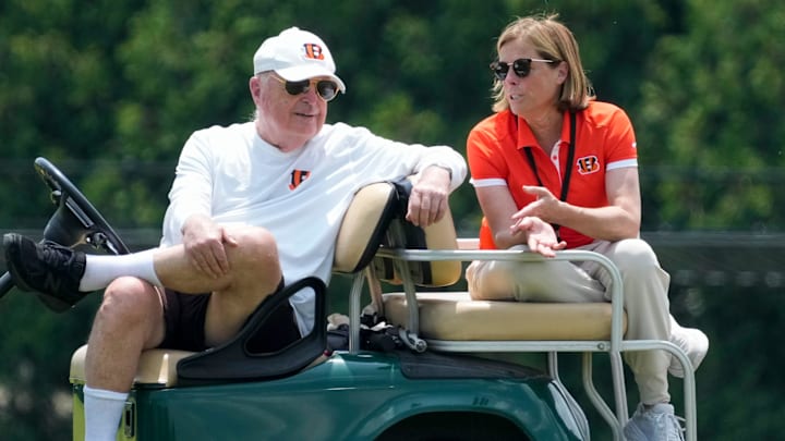 Cincinnati Bengals executives Mike Brown and his daughter Katie Blackburn talk on the sideline during a session of organized team activities on the Bengals practice field at Paycor Stadium in downtown Cincinnati on Tuesday, June 3, 2025.