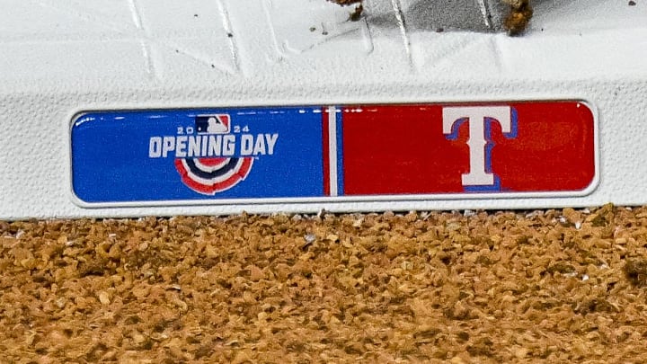 A view of third base and the Texas Rangers logo and Opening Day logo. 