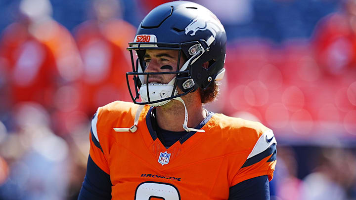 Oct 13, 2024; Denver, Colorado, USA; Denver Broncos quarterback Jarrett Stidham (8) warms up before the game against the Los Angeles Chargers at Empower Field at Mile High. Mandatory Credit: Ron Chenoy-Imagn Images