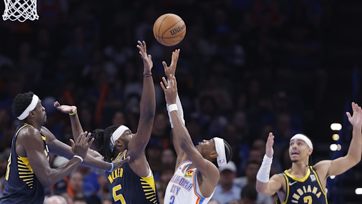 Mar 29, 2025; Oklahoma City, Oklahoma, USA; Oklahoma City Thunder guard Shai Gilgeous-Alexander (2) shoots as Indiana Pacers forward Jarace Walker (5) defends during the second half at Paycom Center. Mandatory Credit: Alonzo Adams-Imagn Images Mar 29, 2025; Oklahoma City, Oklahoma, USA; Oklahoma City Thunder guard Shai Gilgeous-Alexander (2) shoots as Indiana Pacers forward Jarace Walker (5) defends during the second half at Paycom Center. Mandatory Credit: Alonzo Adams-Imagn Images