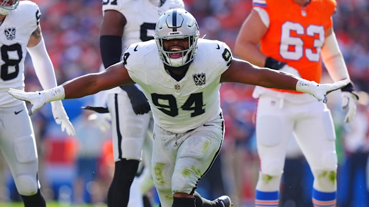 Oct 6, 2024; Denver, Colorado, USA; Las Vegas Raiders defensive tackle Christian Wilkins (94) celebrates his sack in the second quarter against the Denver Broncos at Empower Field at Mile High. Mandatory Credit: Ron Chenoy-Imagn Images Oct 6, 2024; Denver, Colorado, USA; Las Vegas Raiders defensive tackle Christian Wilkins (94) celebrates his sack in the second quarter against the Denver Broncos at Empower Field at Mile High. Mandatory Credit: Ron Chenoy-Imagn Images