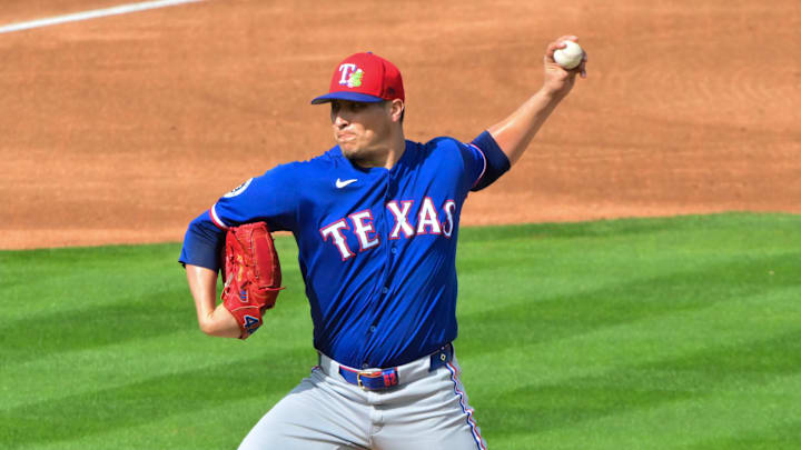 Texas Rangers pitcher Robert Garcia throws a baseball. 