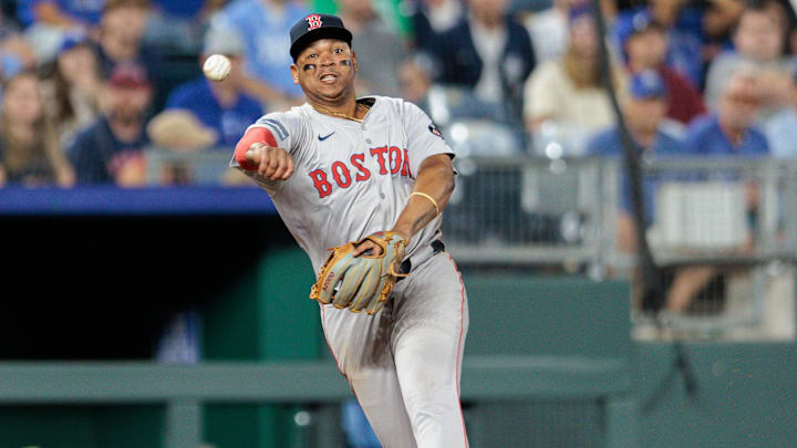 Aug 6, 2024; Kansas City, Missouri, USA; Boston Red Sox third base Rafael Devers (11) throws to first base during the eighth inning Kansas City Royals at Kauffman Stadium. Mandatory Credit: William Purnell-Imagn Images