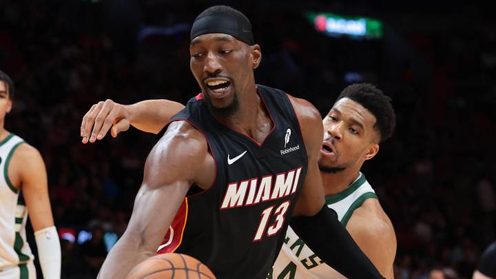 Mar 12, 2026; Miami, Florida, USA; Miami Heat center Bam Adebayo (13) protects the basketball against Milwaukee Bucks forward Giannis Antetokounmpo (34) during the third quarter at Kaseya Center. Mandatory Credit: Sam Navarro-Imagn Images